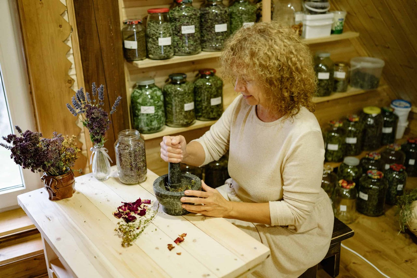 woman crushing herbs